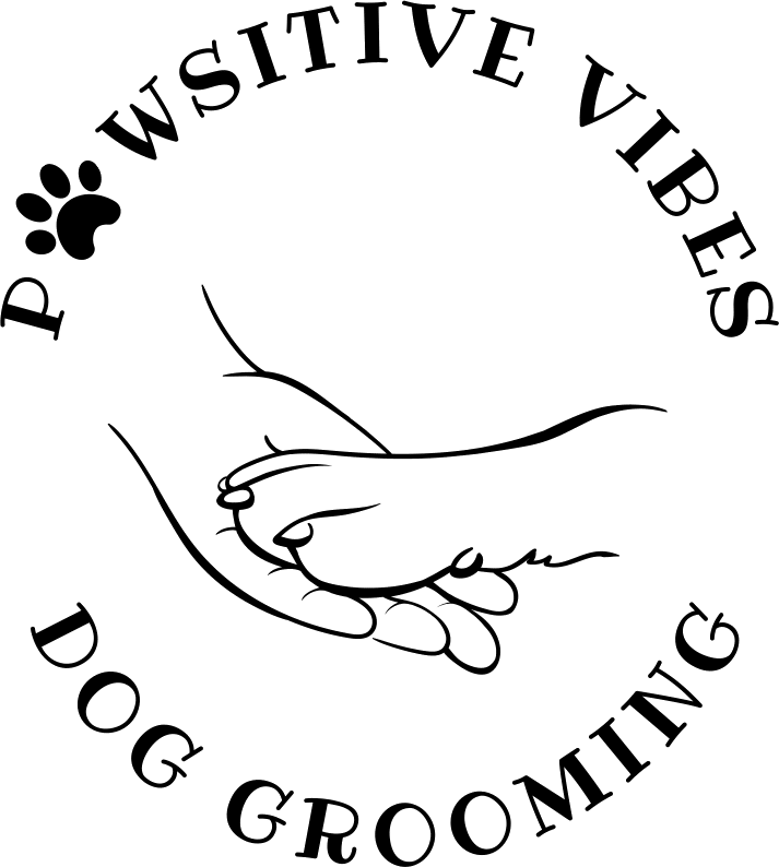 Hand holding dog's paw in logo